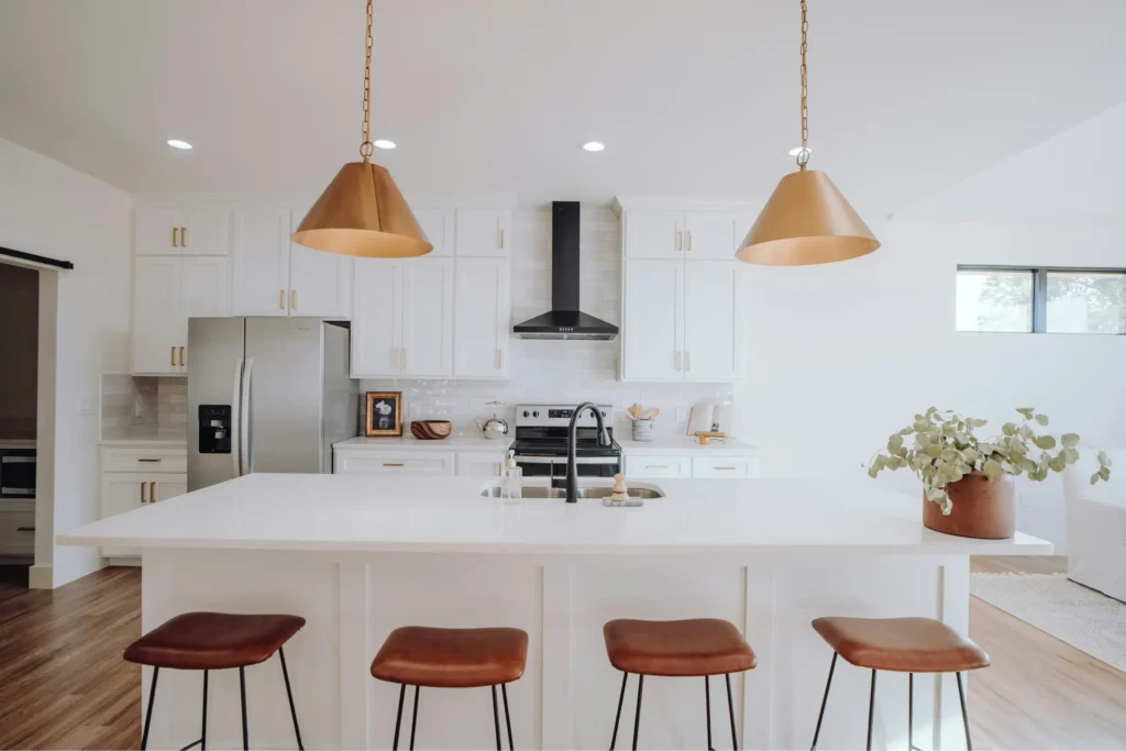 Bright, clean modern kitchen with white cabinets and hardwood floors in a Northern Virginia home