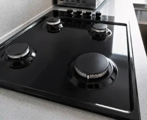 Clean gas stovetop after Costina house cleaning